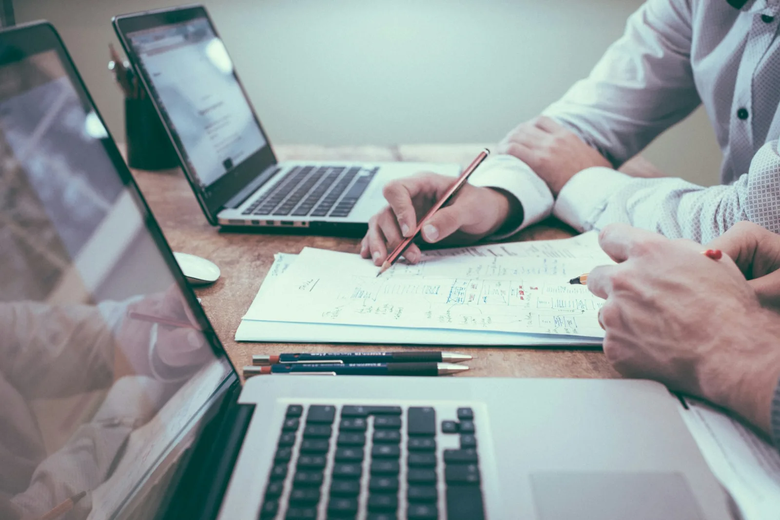 Loan consultation desk at LoanBridge Consultants (Demo) — reviewing documents and EMI options with a client