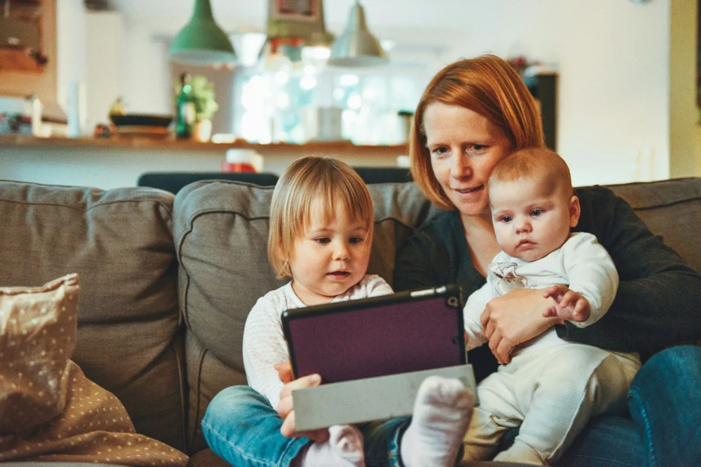 Parents and children at home together — the family a health and life cover plan protects