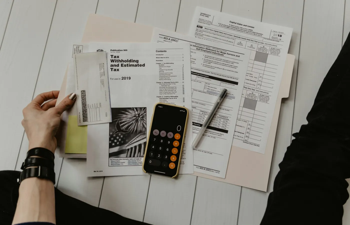 Retirement income plan notes and projections laid out on a desk